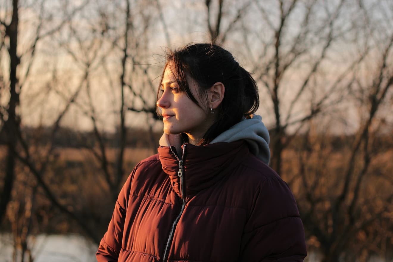 woman-enjoys-the-outdoors-at-sunset