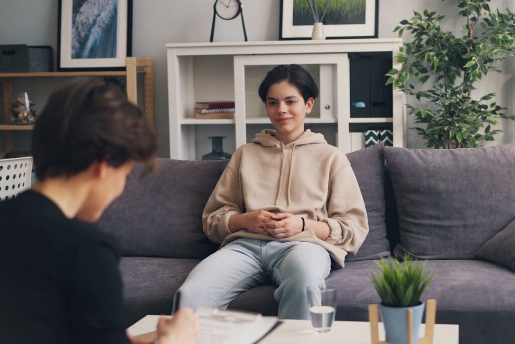woman-sitting-on-a-couch-talking-to-a-therapist