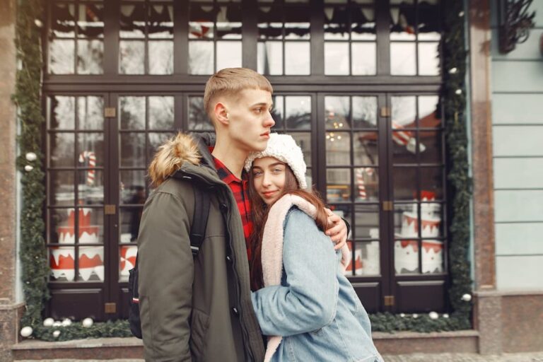 man-in-black-jacket-hugging-woman-in-blue-denim-jacket