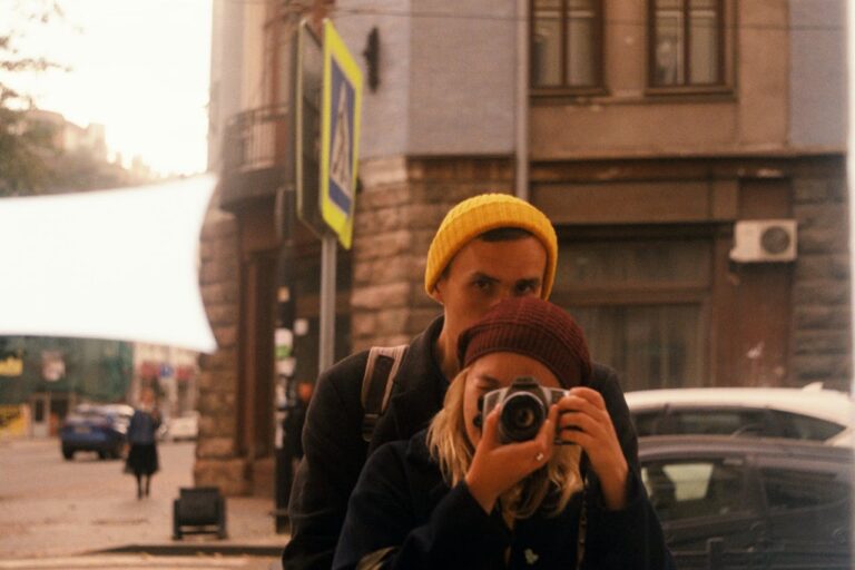 a-woman-taking-a-picture-with-a-camera