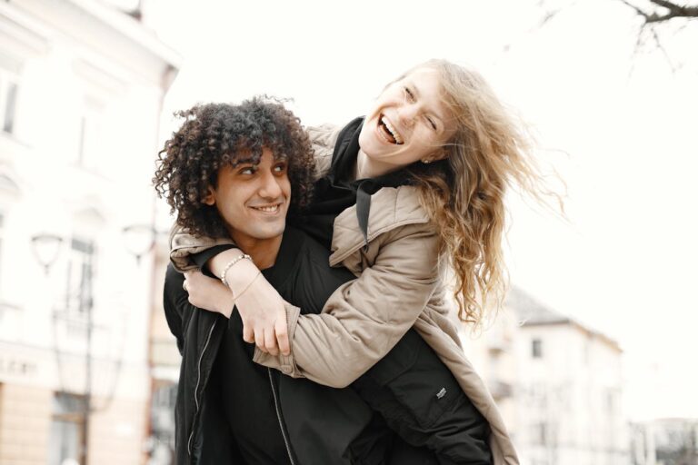 man-carrying-smiling-woman