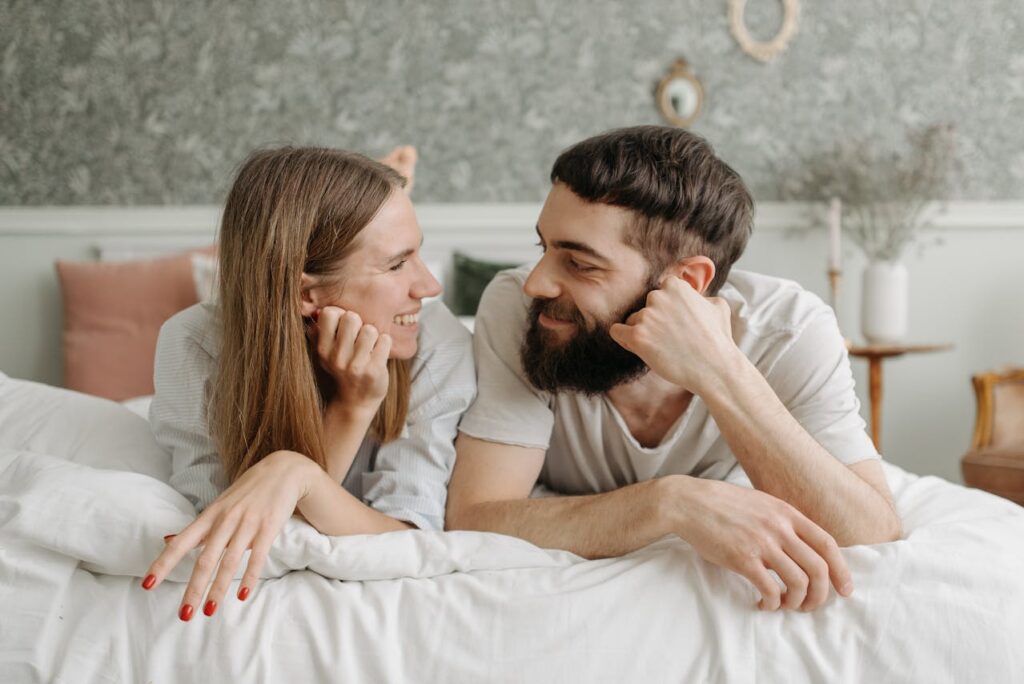 man-and-woman-lying-on-bed