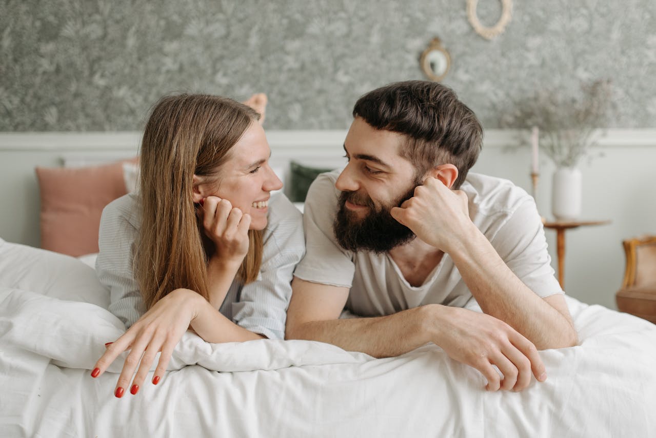 man-and-woman-lying-on-bed