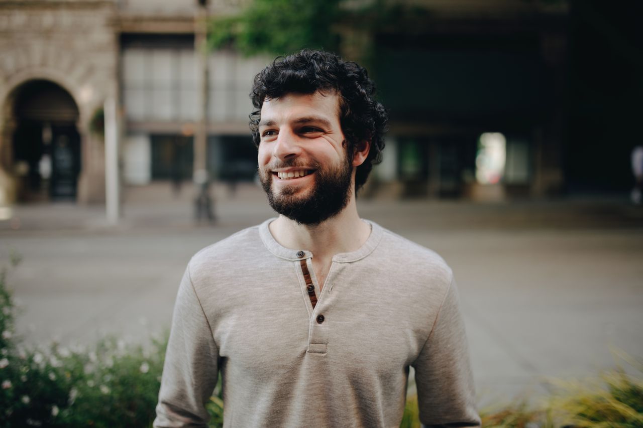 a-man-smiling-with-beard