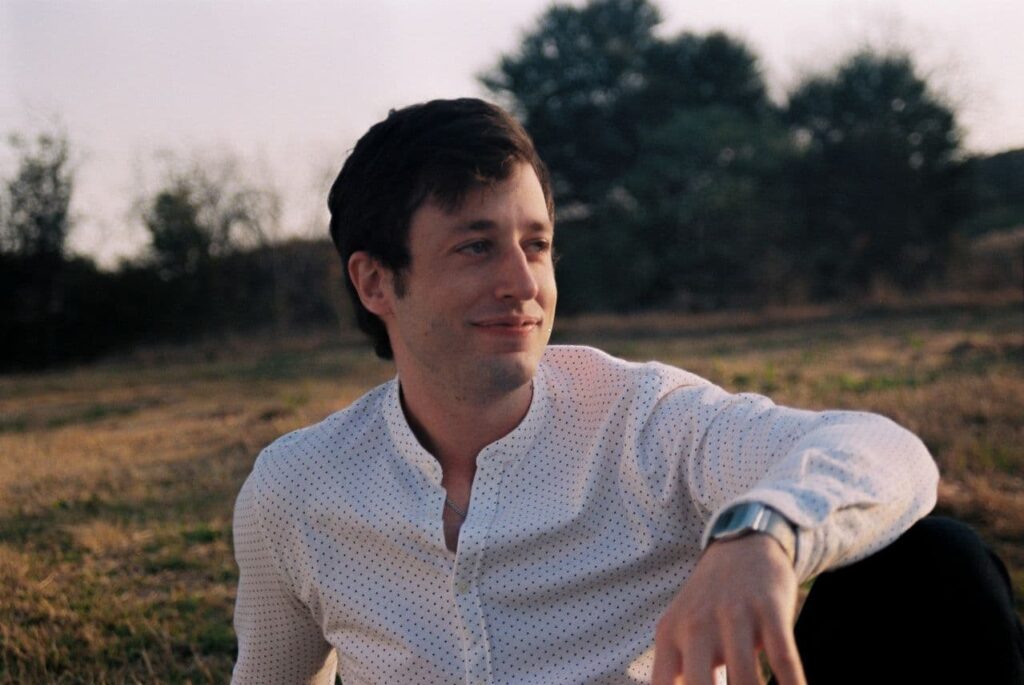 man-relaxing-outdoors-in-casual-attire