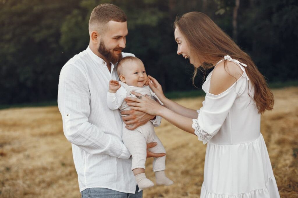 woman-making-the-cute-baby-laugh