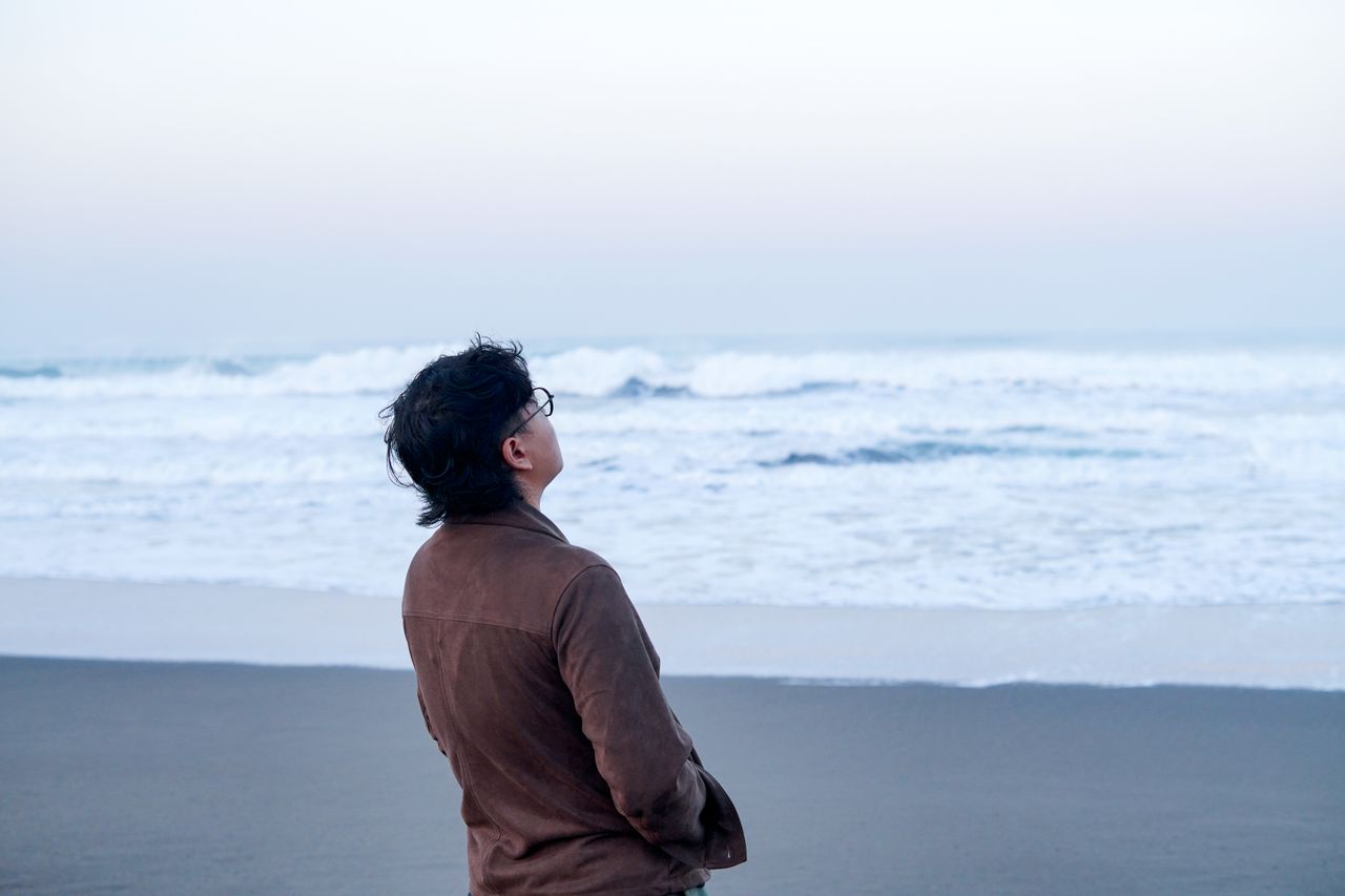 contemplative-moment-by-the-sea-at-sunrise