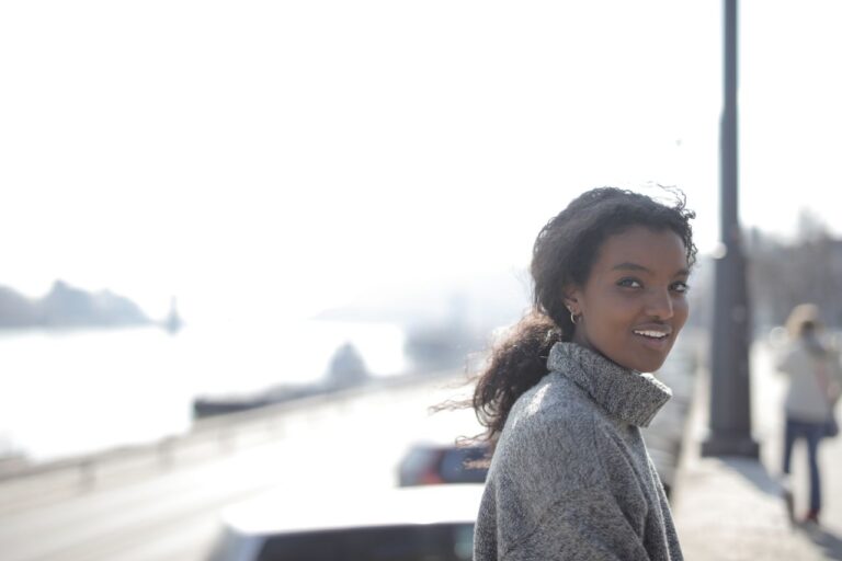woman-in-gray-sweater-smiling