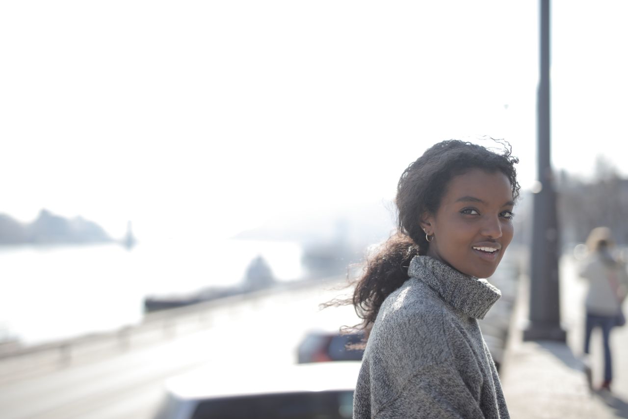 woman-in-gray-sweater-smiling