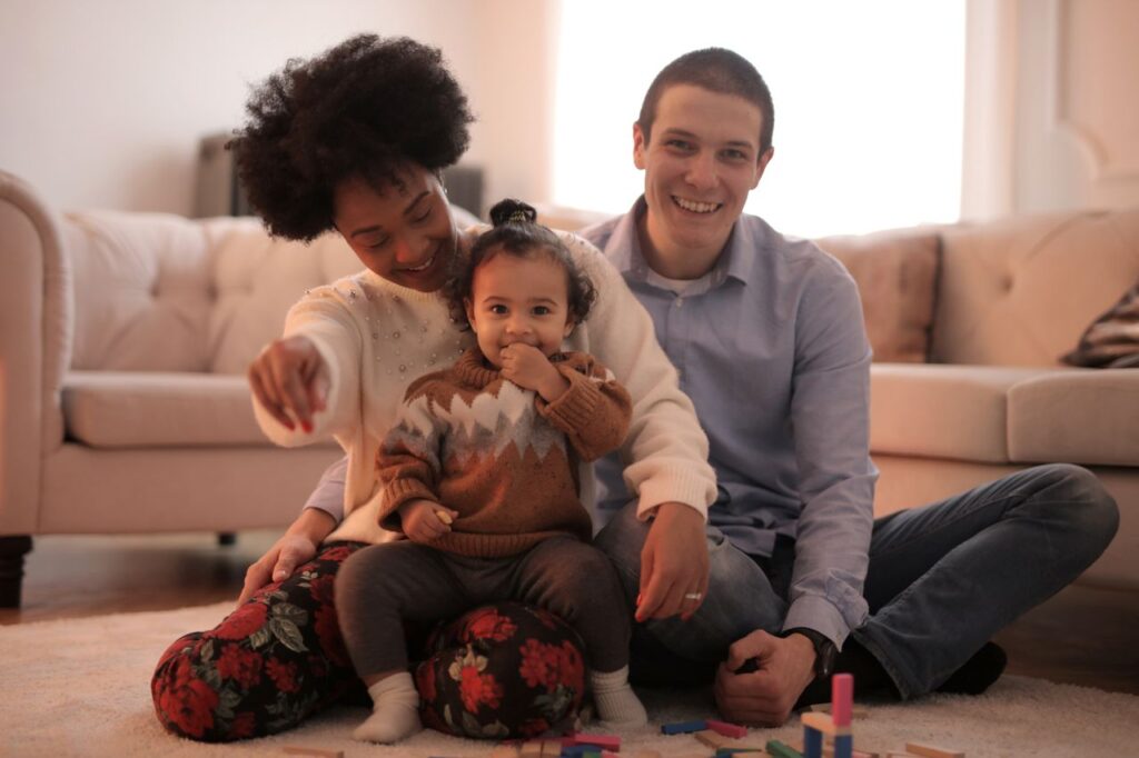 man-and-woman-having-fun-with-their-child